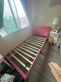 Pink twin bed frame and mattress