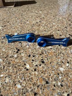 Bombshell chain tensioners