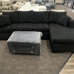Black Sectional And Ottoman 