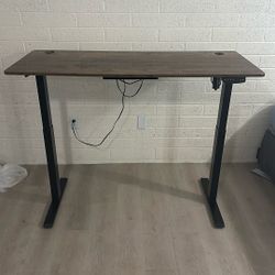 Desk  Electric standing Desk adjust to the hight you want Moving sale check out other listings