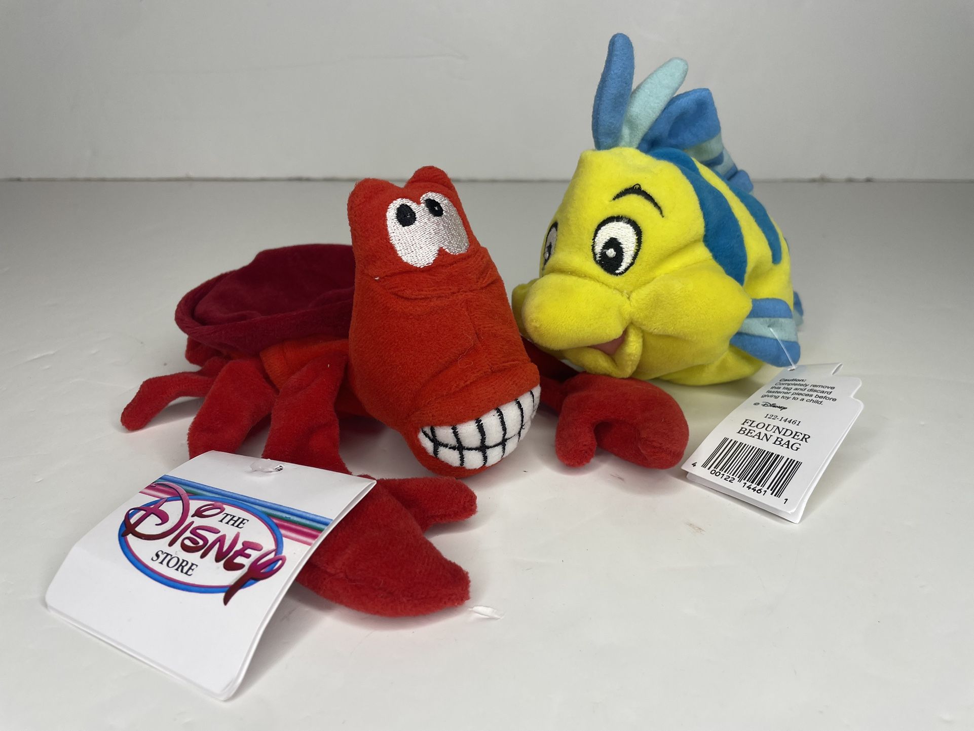 The Disney store little mermaid plushies