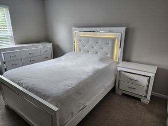 Set for bedroom. White bed frame, nightstand  and drawers with lights. Solid wood.