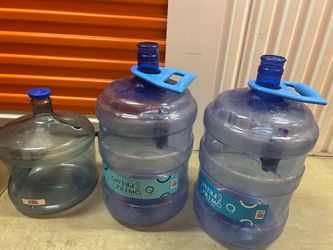 Three Primo Water bottles