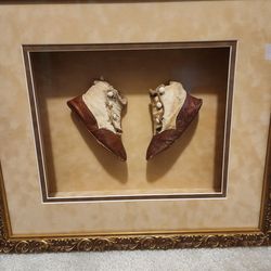 Antique baby shoes framed