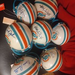 Collection of signed Miami dolphins NFL mini helmets full Size