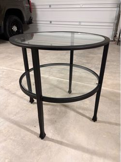 Two Pottery Barn glass side tables