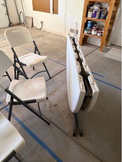 Round folding table and 5 chairs