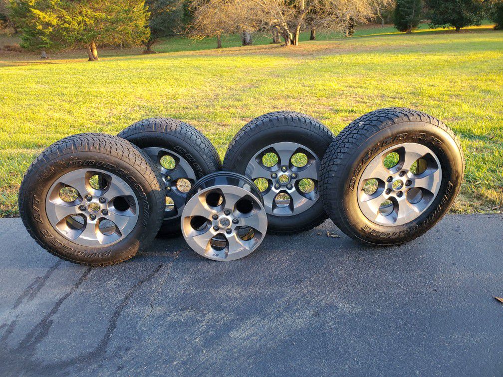 Jeep 18" upgraded 5 wheels and 4 tires. Fits all 5 lug nut vehicles.