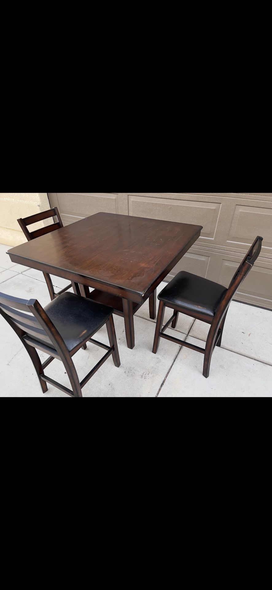 Dining table with three chairs in good condition