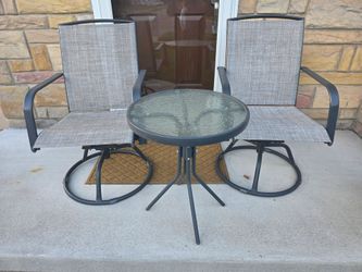 2 swivel patio chairs and table