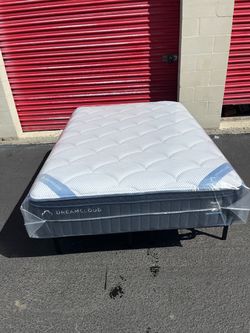 Brand new full-size plush pillow top DreamCloud Premier Hybrid mattress in plastic