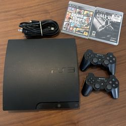 PS3 With 2 Controllers, 2 Games & All Working Cords