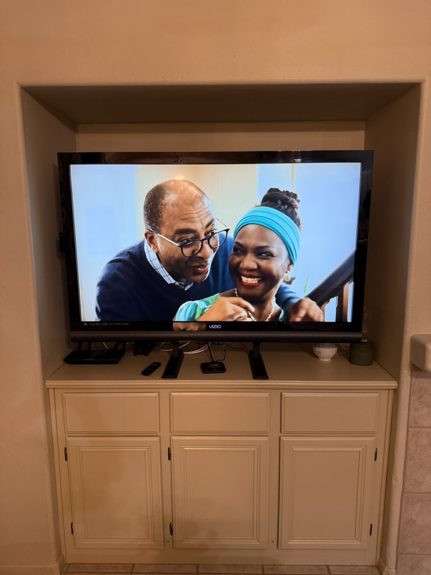 55’ Vizio Flat Screen TV With A Roku Box And Stand And Wall Mount