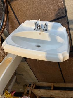 Free pedestal bathroom sink with faucet