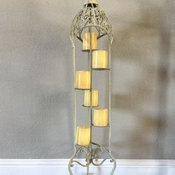 Metal candle holder with candles. 