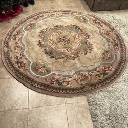 8 foot round area rug, beautiful beige with some pink flowers, . Veri nice condition $70 or best offer.   Contact me I will send you the phone number 