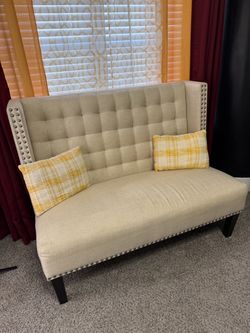 Cream loveseat with high back & pillows