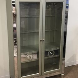 Two piece glass curio cabinet