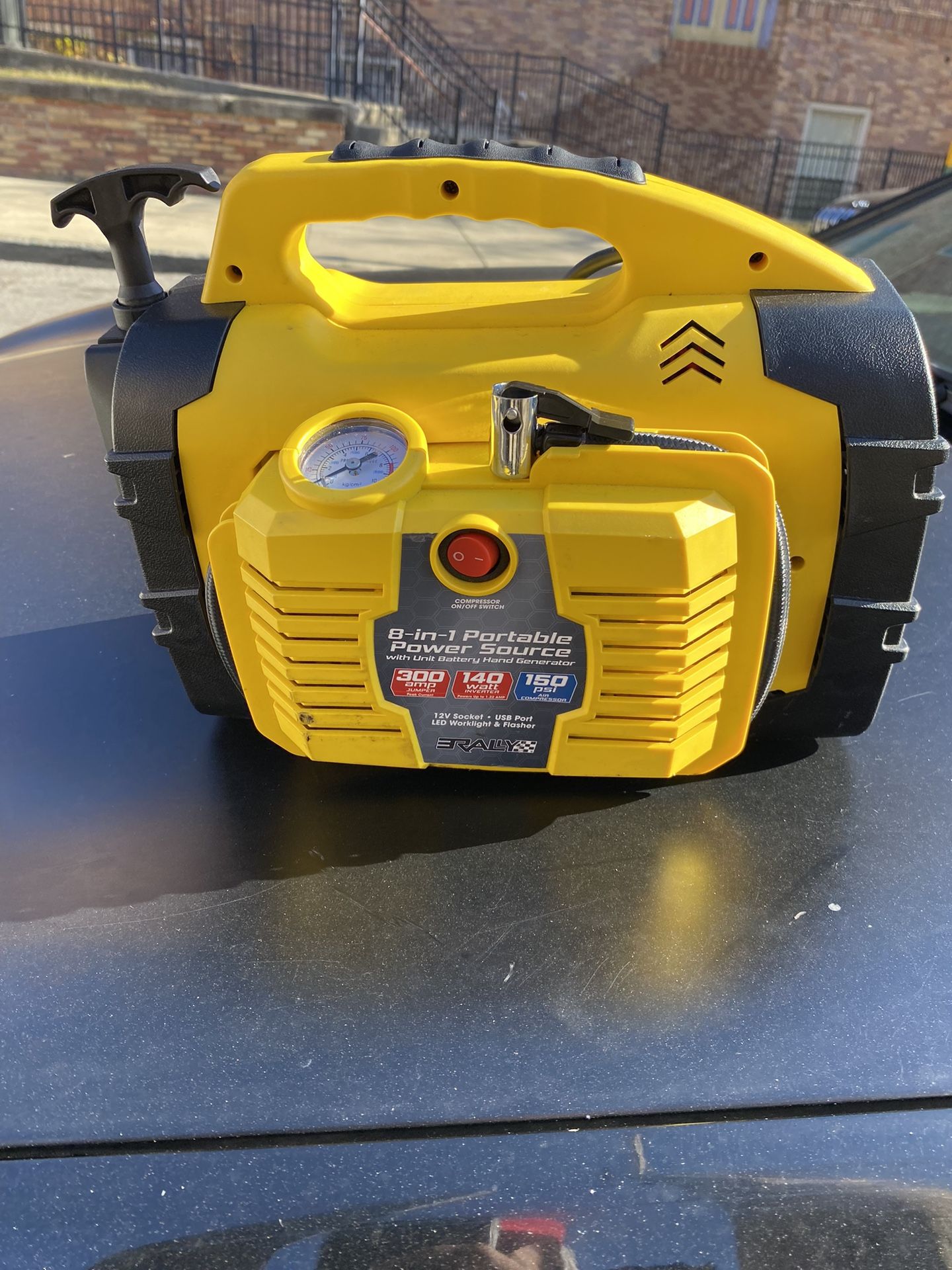 Rally Portable 8 in 1 Jump Starter and Power Source Unit with Air Compressor/Tire Inflator, AC/DC Power Outlets, LED Work Light and Hand Generator