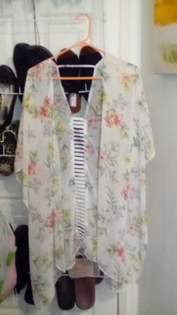 Flowy white see through cover with flowers