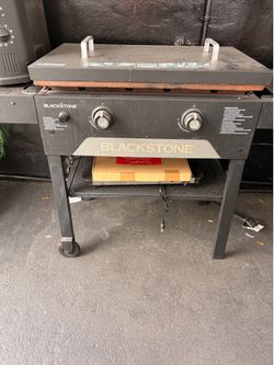 Patio furniture and barbecue pit also Blackstone griddle