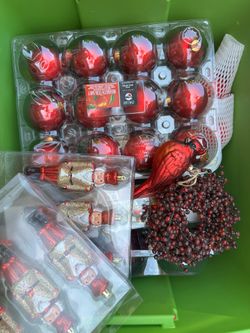 Box full of red Christmas ornaments