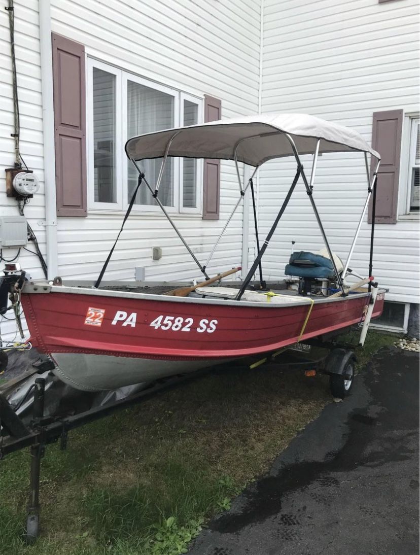 1979 Blue Fin 14’ Aluminum V Hull boat with 15HP Johnson motor and Trailer