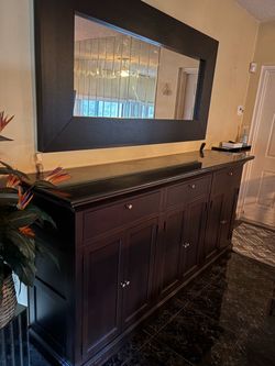 Mahogany buffet with black granite, top and mirror