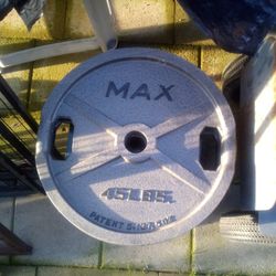 Set Of Olympic Weights With 45 Lbs Bar