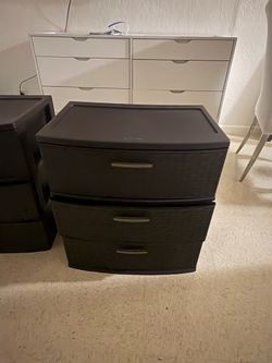 Two plastic drawer bins