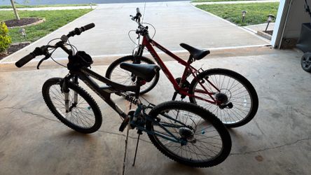 Two bicycles need maintenance.