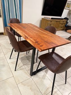 Dining room table and four leather chairs