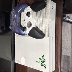 Xbox with headset and two controllers