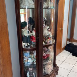 Glass Cabinet And Porcelain Dolls 