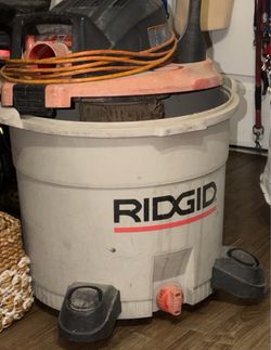 Preowned heavy-duty RIDGID 16-Gallon 6.0 Peak HP Wet/Dry Vacuum It features a large capacity tank, on-board attachment storage slots, a top carry hand