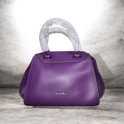 purple handbag features structured top handles covered in protective packing material.