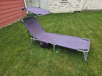 Folding lounge chair with canopy