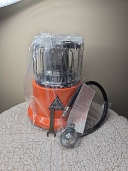 NIB 2-in-1 Heater and Stove A 2-in-1 camping heater and cooking stove.