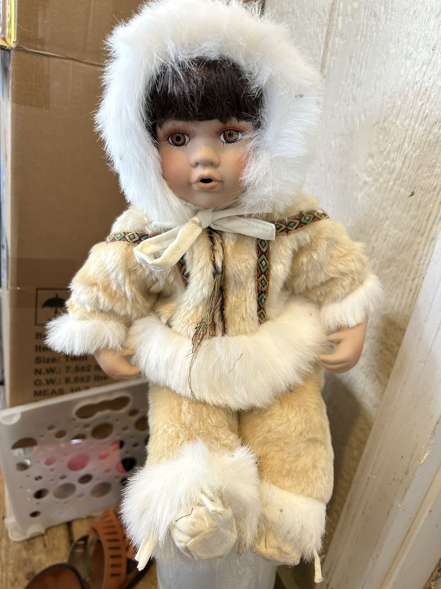 Vintage Porcelain Faced Alaskan Native American Treasure There is a small hole on the top of her pants which the jacket completely covers