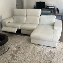 Leather Sofa With Power Recline And Headrest.