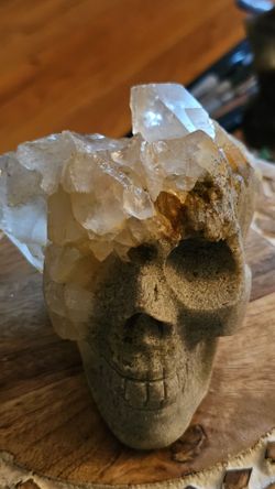 Carved Stone Skull with Quartz Crystal Clusters