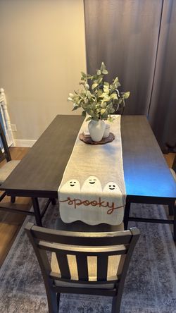 Dark grey table with 8 matching chairs