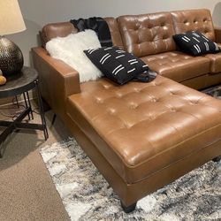 Baskove Auburn Leather Match 2pc Sectional w/ Chaise  