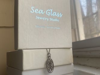 Southern Gates Oval Flower Scroll Pendant
