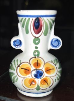 Small hand‑painted Mexican Talavera pottery vase, double handles. Size: 3"H x 2"D. Minor chip on rim. $6 firm. Pickup only.