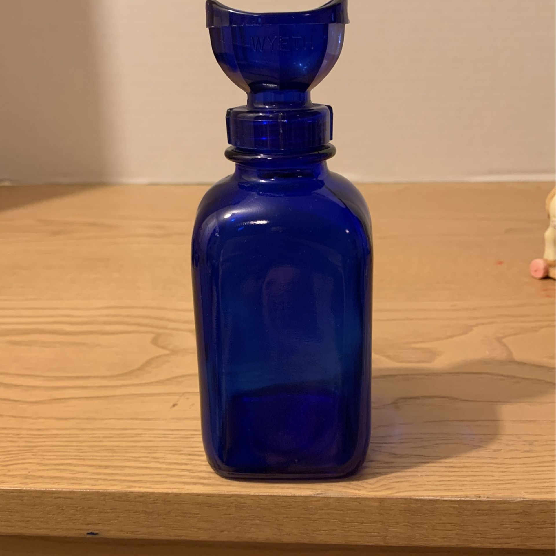 Cobalt Blue Eye Wash Bottle Original Label Drugstore 7oz Vintage Wyeth Collyrium Eye Cup is plastic five and three-quarter inches by 2 inches