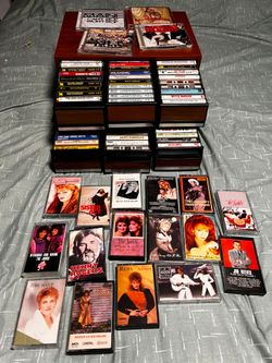 70 cassettes and 4 CD's  and 2 cassettes cabinet holder