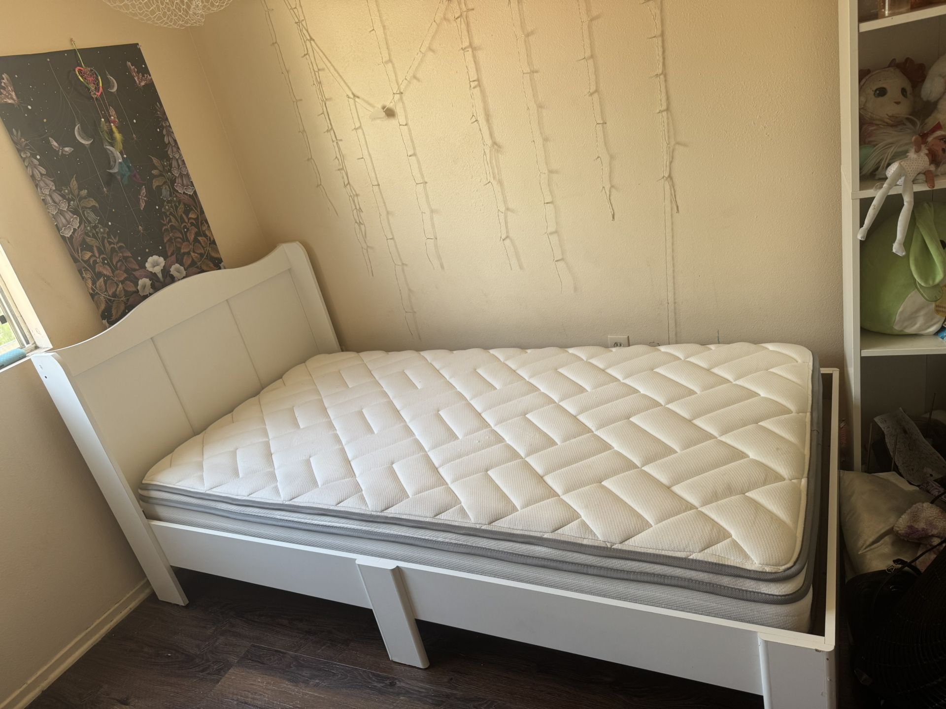 White twin bed frame and mattress