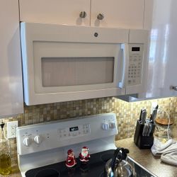 White GE brand Microwave 1.7 Cubic Feet