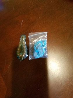 Glass charm with cord.